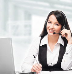 Young, confident and beautiful customer support operator working