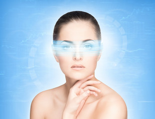 Portrait of a beautiful naked woman with a hologram