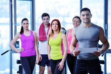 Fototapeta na wymiar Group of people exercising at the gym