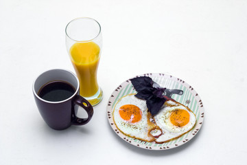 Breakfast with coffee orange juice and eggs