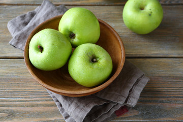 Ripe apple in a clay bowl