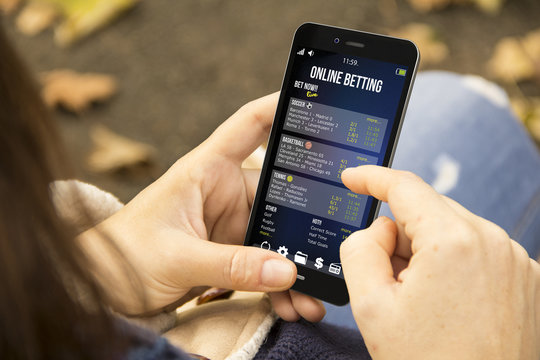 woman betting online  in the park