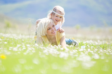 Happy woman with a child resting on the nature