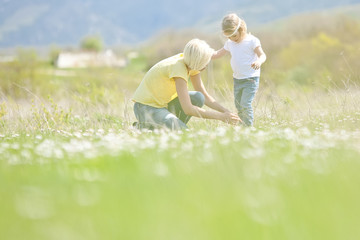 Fototapeta premium Happy woman with a child resting on the nature