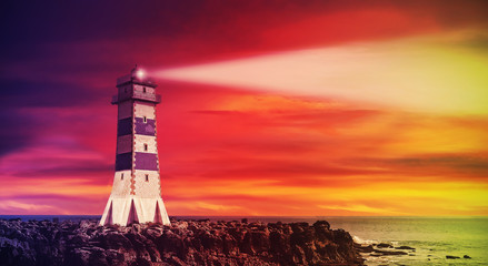 Seascape with lighthouse at sunset, color toning applied. © MaciejBledowski