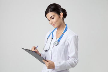 Smiling medical doctor woman with stethoscope.