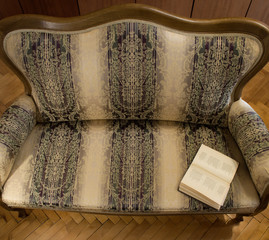Vintage sofa and open book