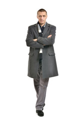 Obraz na płótnie Canvas Confident man posing in coat
