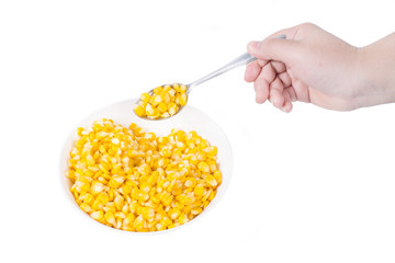 Sweet corn in white bowl ready for eat with hand and spoon