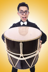Obraz na płótnie Canvas Funny man with drum on white