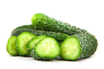 Cucumber and slices isolated over white background.