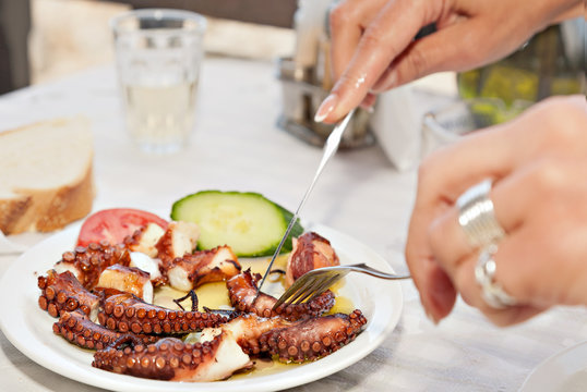 The Process Of Eating The Delicious Grilled Octopus