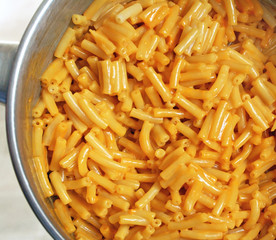Pot of cooked and mixed Macaroni and Cheese prepared from a box