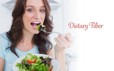 Dietary fiber against brunette eating healthy salad