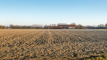 Plowed field and a farm