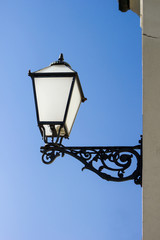 Fototapeta na wymiar vintage streetlamp with blue sky in a background