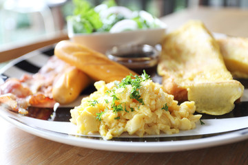 Breakfast of  bacon, toast and egg