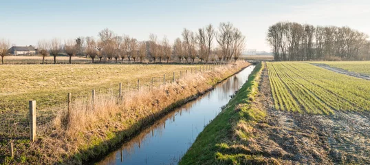 Rolgordijnen Rural area intersected by a ditch © Ruud Morijn
