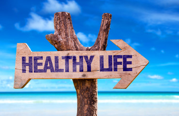 Healthy Life wooden sign with beach background
