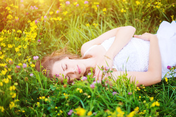 Beautiful woman on a meadow.