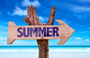 Summer wooden sign with beach background