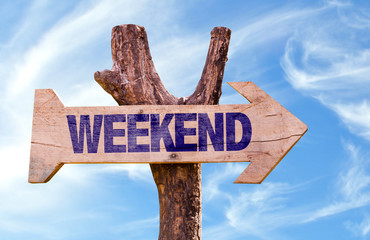 Weekend wooden sign with sky background