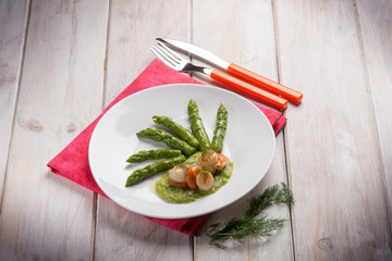 scallop over asparagus cream and boiled asparagus salad