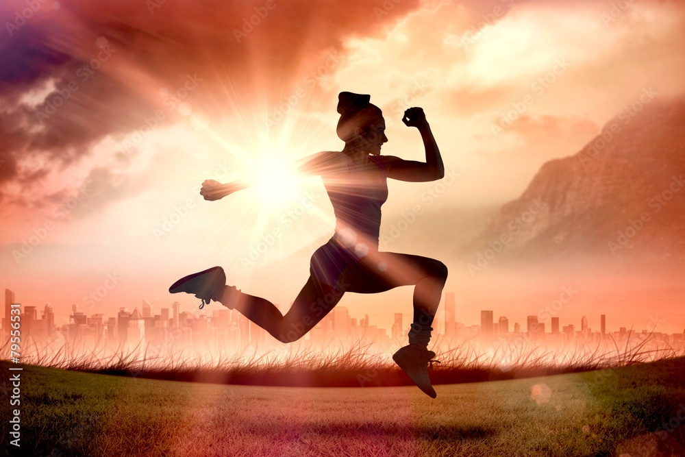 Poster Composite image of fit brunette running and jumping