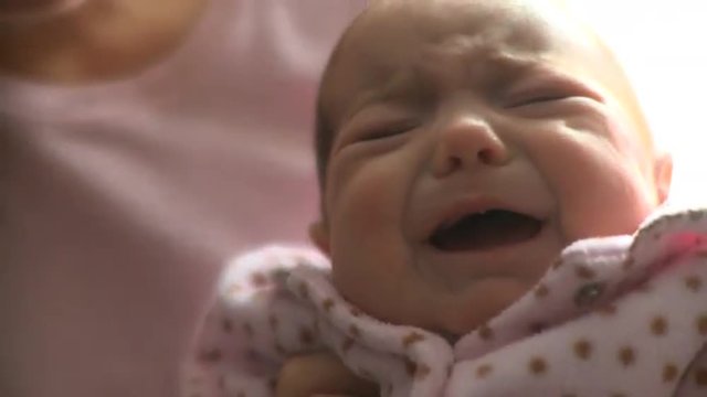 A crying two month old infant.