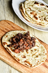 Mexican cuisine. Fried tortilla with meat.