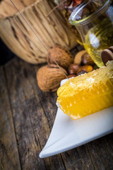 honey dipper and honeycomb, nuts of various kinds
