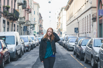 Beautiful girl posing in the city streets