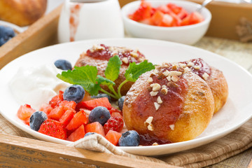 cottage cheese pancakes with fresh berries, cream for breakfast