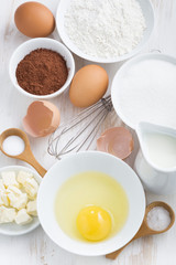 ingredients for baking on a white table, top view