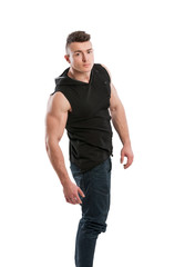 Fototapeta premium Young man wearing jeans and black hoodie