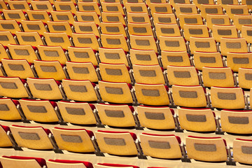 Rows of many seats in a stadium.