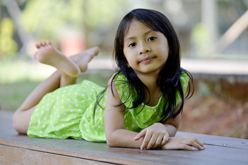 Happy little girl playing outside