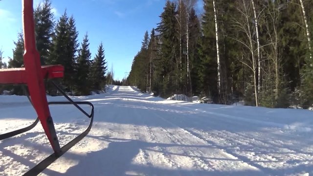 Riding kicksledge on road