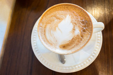 Beautiful latte art Coffee in withe cup
