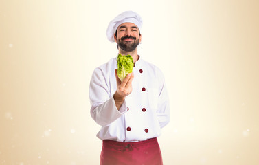 Chef holding a lettuce