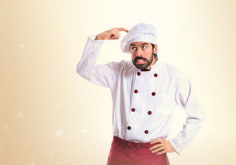 Chef thinking over white background