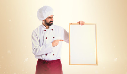 Chef holding empty placard