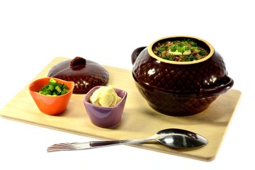 Buckwheat, butter and herbs on a cutting board