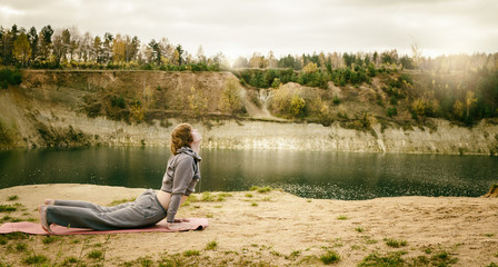 man practices yoga and leads healthy lifestyle