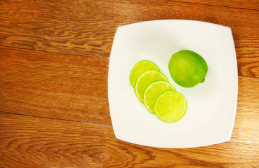 fragrant lime wedges on the saucer