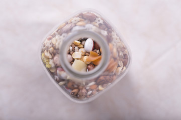glass bottle with seeds, various cereals inside