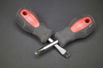 Two old phillips and flat-blade screwdriver