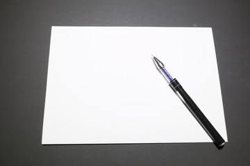 Template blank sheet of paper and a pen