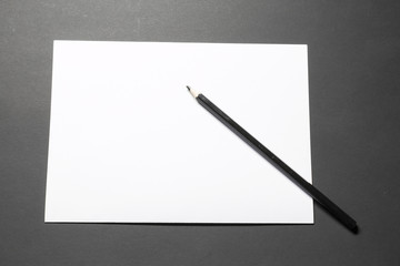 Template blank sheet of paper and black pencil