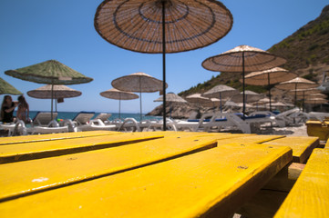 Fototapeta premium Straw umbrella on a beach.